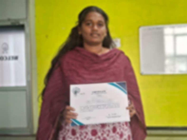 SACM student receiving a certificate of completion from her trainer