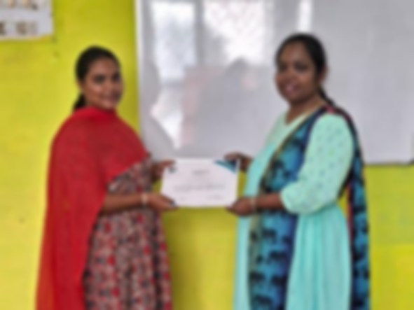 SACM student receiving a certificate of completion from her trainer