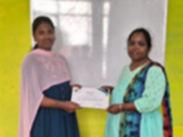 SACM student receiving a certificate of completion from her trainer