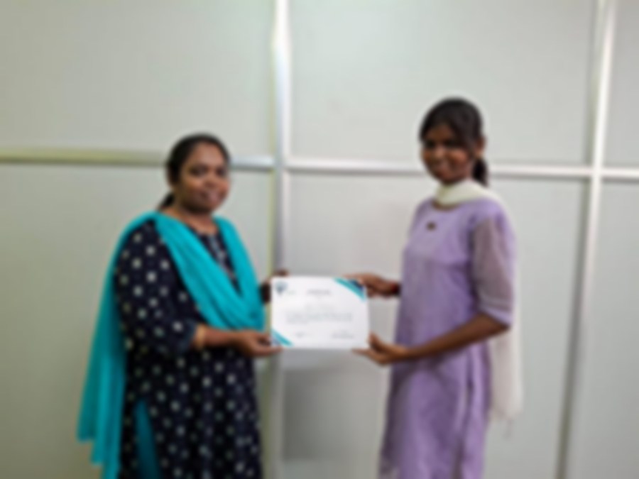 SACM student receiving a certificate of completion from her trainer