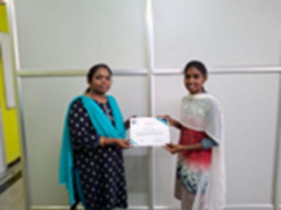SACM student receiving a certificate of completion from her trainer