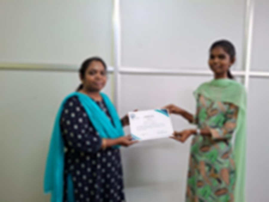 SACM student receiving a certificate of completion from her trainer