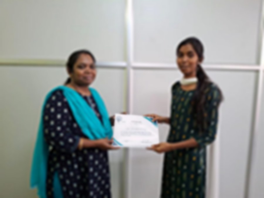 SACM student receiving a certificate of completion from her trainer