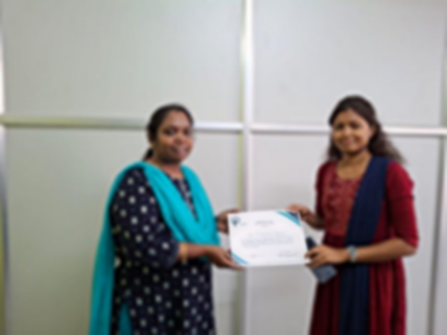 SACM student receiving a certificate of completion from her trainer