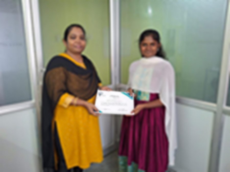 SACM student receiving a certificate of completion from her trainer